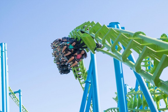 people riding roller coaster